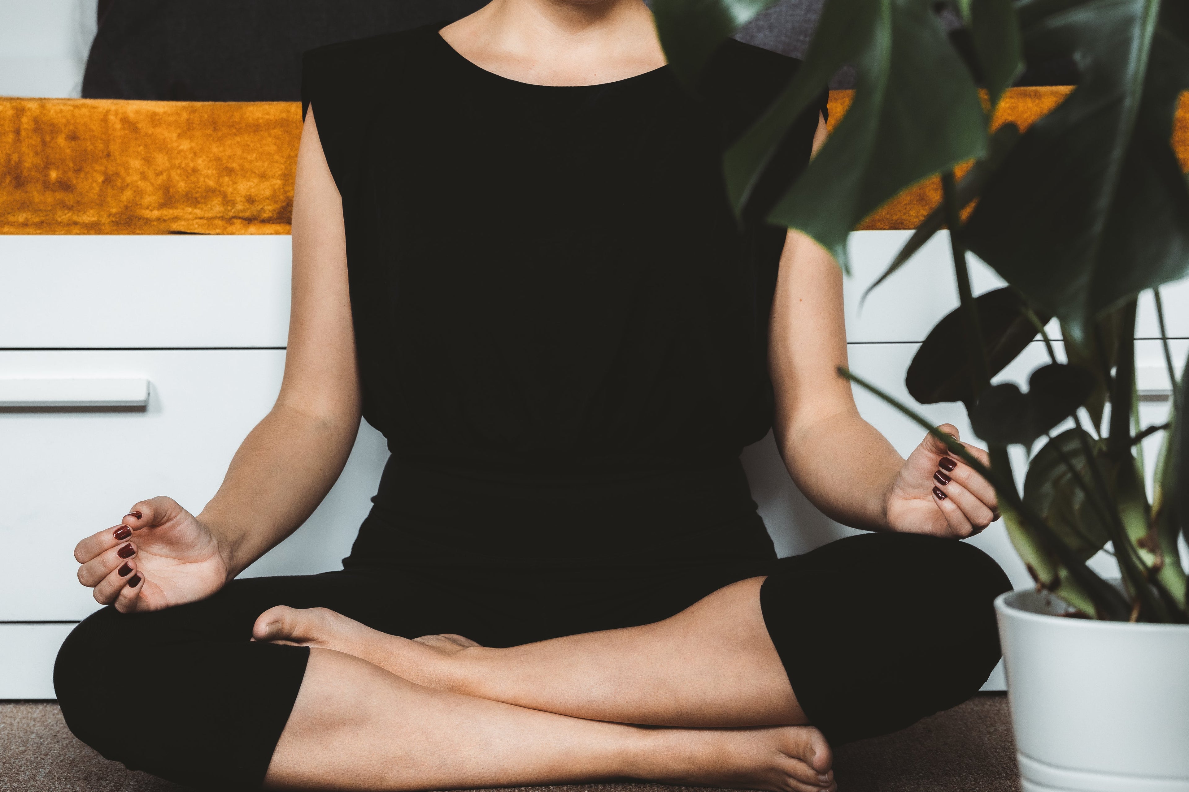 A person sitting quietly at the end of the day